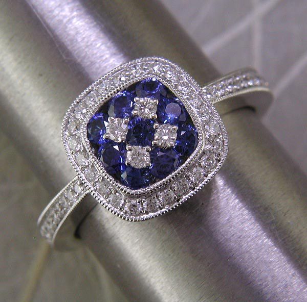 White gold, diamond, and blue sapphire ring. Also available in ruby or tsavorite (green) garnet.