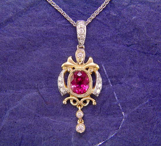 18K white and yellow gold ruby and diamond pendant.