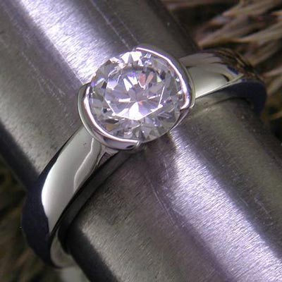 14K semi-bezel solitaire engagement ring. An Ames Silversmithing favorite!