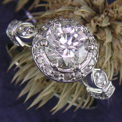 14K white gold regally-styled engagement ring with round diamond.