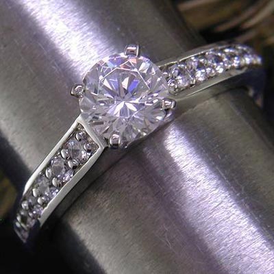 14K white gold cathedral style bead-set engagement ring. One of the all-time classics.