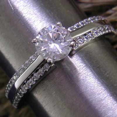 14K white gold cathedral style bead-set engagement ring with hi-polish divide.